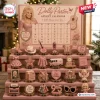 Dolly Parton Advent Calendar 2026 featuring 24 miniature collectible figurines including guitars, cowboy boots, and lyrics.