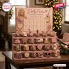 Dolly Parton Advent Calendar 2026 featuring 24 miniature figurines on a tiered pink display with holiday lights background.