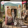 Front view of the Dolly Parton Tribute Collector Edition Figure standing next to its packaging box and miniature guitars.