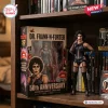 Action figure of Dr. Frank-N-Furter 50th Anniversary Hot Toys displayed next to its original collector box on a shelf.