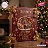 Dr Pepper Advent Calendar 2026 featuring a deep red box with gold bows, ornaments, and festive holiday snowflakes.