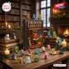 Front view of the Dragon Library Advent Calendar 2026 box surrounded by miniature dragon figurines on a wooden table.