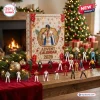 Front view of an Elvis Presley 2026 Advent Calendar box with miniature figurines displayed on a holiday table.