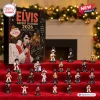 Front view of Elvis Presley 2026 Christmas Advent Calendar with miniature figurines arranged on red velvet.