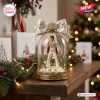 Elvis Presley King Of Rock n Roll Christmas ornament inside a glass dome with an Aloha from Hawaii white jumpsuit figure.