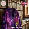Elvis Presley TCB Galaxy Purple Cardigan featuring stars, butterflies, and a gold silhouette on a wooden hanger.