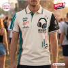 Front view of a cream and green Feel The Beat Headphone Polo Shirt with music graphics worn by a person.