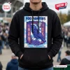 Front view of a black pullover hoodie featuring a graphic of a raven, a clock, and a lotus flower.
