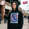 Man wearing a black pullover hoodie with a Foo Fighters 2026 Tour Mosaic Stadium graphic featuring a crow and lotus flower.