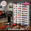 Formula 1 Diecast Car Advent Calendar display case with numbered slots, helmets, and miniature racing vehicles on a desk.