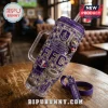 Fremantle Dockers 32nd Anniversary 40oz Stanley Tumbler with purple accents, gnome graphic, and team logo on a wood table.