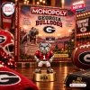 Front view of a Georgia Bulldogs Collector Edition Monopoly game box and a metallic bulldog player token on a gold base.