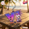 Front view of a Grand Theft Auto VI custom shape acrylic keychain featuring purple V graphic and characters on a wooden picnic table.