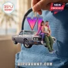 Grand Theft Auto VI Lucia and Jason Christmas ornament featuring the characters on a car with a large neon purple VI logo.