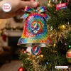 Grateful Dead 60th Anniversary Bell Ornament with tie-dye patterns, dancing bears, and a skull logo hanging on a pine tree.