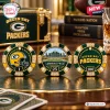 Close-up of three decorative poker chips featuring Green Bay Packers imagery and Lambeau Field in a deluxe set.