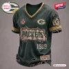 Front view of a dark green Green Bay Packers t-shirt featuring a distressed finish and aged text design.
