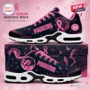 Side view of Green Bay Packers x Breast Cancer Awareness sneakers with pink ribbons and dandelion graphics.
