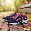 Side view of Green Bay Packers x Breast Cancer Awareness Air Max Plus Sneakers on a park bench.
