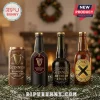 Guinness Advent Calendar 2026 featuring four distinct stout bottles on a pine branch with a blurred fireplace background.