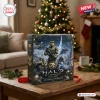 Halo 25th Anniversary Christmas Advent Calendar 2026 box featuring Master Chief, a Warthog, and numbered doors on table.