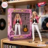 Front view of the Hannah Montana 20th Anniversary Action Figure outside its pink packaging box next to acoustic guitar.