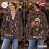Front and back view of a purple knitted cardigan featuring three women and magical motifs.