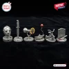 Horror Halloween 2026 Monopoly Game miniature metal tokens including a hockey mask, knife, sunflower, boat, and tombstone.