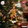 Hulk Hogan x Ultimate Warrior Wrestling Christmas ornament featuring Hulk Hogan in yellow gear hanging on a pine tree.
