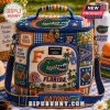 Igloo Florida Gators quilted lunch bag with blue, orange, and white patchwork patterns featuring team logos and symbols.