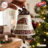 Close up of an Indian Motorcycle 125th Anniversary bell ornament featuring a motorcycle topper and hanging feather.