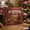 Hand pulling a small box from an Indiana Hoosiers Football Ornament Advent Calendar with a stadium graphic.