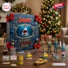 Jaws Advent Calendar 2026 featuring shark, Orca boat, and Amity Island figurines on a wooden table near a holiday tree.