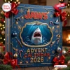 Jaws Advent Calendar 2026 featuring a great white shark illustration, holiday ornaments, and gold accents on a blue box.
