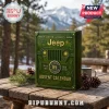 Jeep 85th Anniversary 2026 Advent Calendar in dark green with a front grille design on a rustic wooden outdoor table.