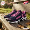 Side view of Kansas City Chiefs Breast Cancer Awareness Air Max Plus sneakers on a wooden bench.