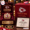 Closeup of a Kansas City Chiefs Championship gold ring displayed in a red velvet presentation box with a matching case.