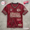 Front view of a red distressed Kansas City Chiefs NFL football t-shirt featuring frayed edges and vintage team graphics.