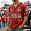 Front view of a distressed red Kansas City Chiefs football t-shirt featuring frayed edges and vintage style graphics.