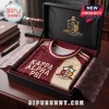 Kappa Alpha Psi Achievement Heritage T-Shirt in crimson and cream, folded in a black gift box with fraternity emblems.