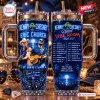 Front and side view of a blue tumbler featuring Kenny Chesney Eric Church Vibe Room 2027 graphics and rhinestone trim.