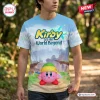 Front view of a person wearing a Kirby and the World Beyond Blue Sky shirt featuring a green helmet-wearing character.