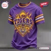 Front view of a purple LSU Tigers mascot t-shirt featuring a yellow diamond graphic and sleeve stripes.