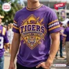 Front view of a purple LSU Tigers t-shirt with a diamond-shaped graphic of a tiger head and yellow stripes on sleeves.