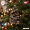 McLaren 63rd Anniversary Christmas ornament featuring a spiral race track with miniature cars on a green holiday tree.
