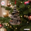 McLaren 63rd Anniversary Christmas Ornament featuring a spiral racetrack, F1 cars, and a podium on a pine tree branch.