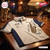 Front view of a Men's Jazz Soul Saxophone Polo Shirt on a wooden table in a dimly lit room.