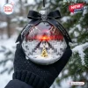 Metallica Master of Puppets 45th Anniversary glass ornament featuring miniature tombstones and a black ribbon.