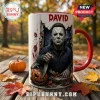 Michael Myers David Custom Halloween Coffee Mug with a red handle and horror movie illustration on a park bench background.