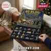 Michigan Wolverines 24-Day Christmas Advent Calendar box with collectible team ornaments displayed on a wooden table.